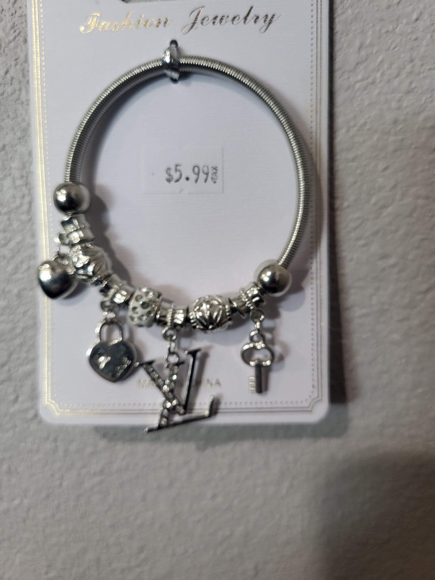 LV inspired silver tone bracelet