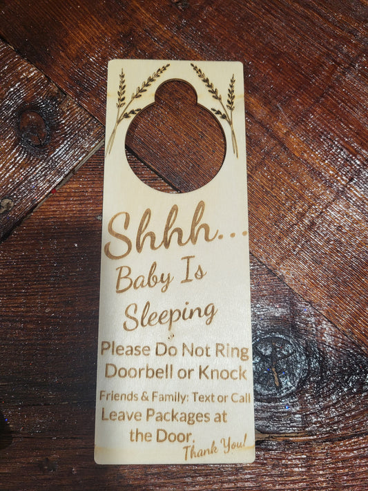 Wooden Shhh baby is sleeping door hanger