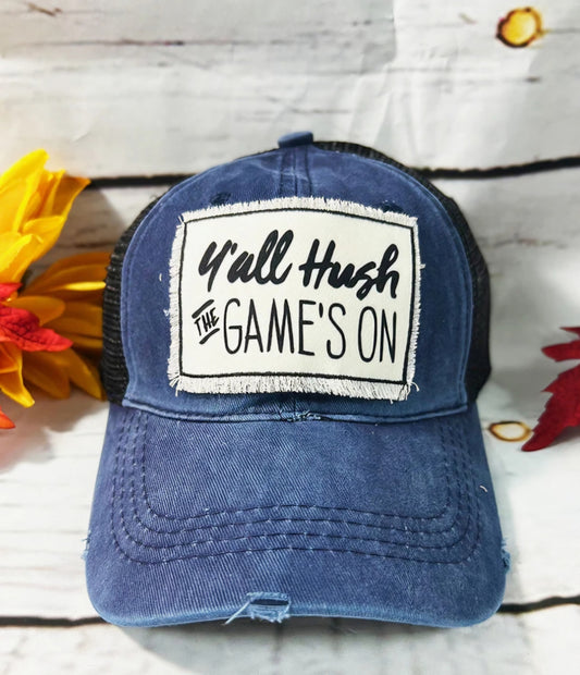 Y'ALL HUSH THE GAME'S ON PATCH ON HIGH PONYTAIL NAVY BLUE HAT WITH BLACK MESH